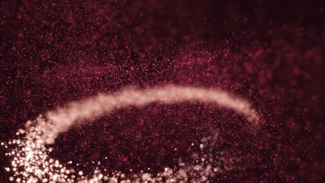 A mesmerizing slow-motion video featuring a glowing, continuous arc of shimmering particles in deep red background