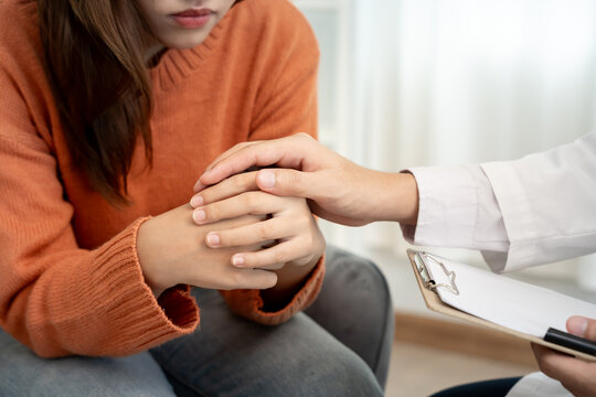 psychiatrist hold hand support each while discussing family issues. doctor encourages and empathy man suffers depression. psychological, save divorce, Hand in hand together, trust, care