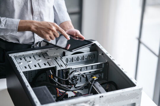 Computer repair technician specialist repairing and testing on Pc
