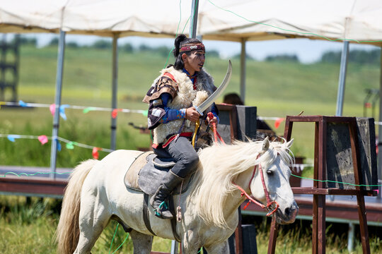 Mongolian warriors fighting on horseback during the Naadam Festival