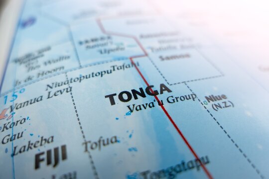 Map of Tonga with flare from top right corner. Selective focus on label, close-up view