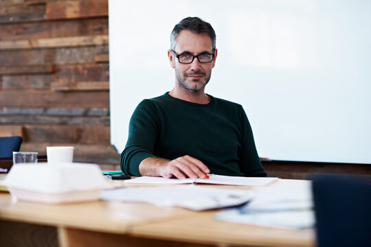 Glasses, smile and portrait of business man in office for planning, campaign manager and about us. Pride, professional and branding advisor with mature employee in agency for creative and startup
