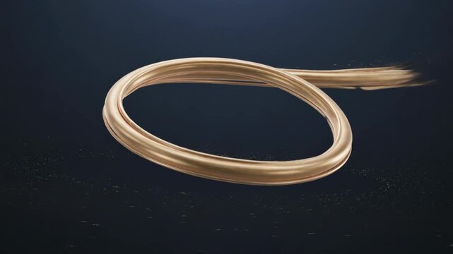 Golden wire twisted into a loop on dark background