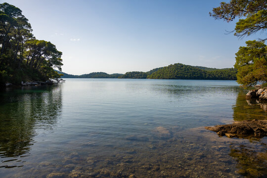 View of Veliko Jezero or Big Lake in Mljet National Park on Mljet Island in Croatia. Protected Mediterranean nature and peaceful lake landscape concept.