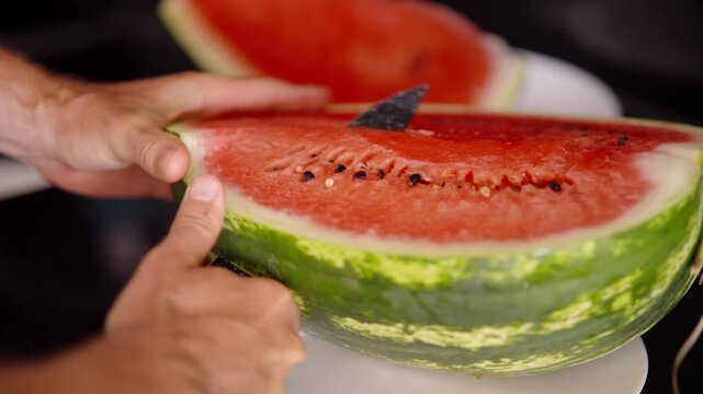 Slicing Ripe Red Watermelon Quarter With Knife 