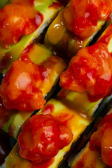 Spicy shrimp and avocado sushi rolls closeup © Cavan