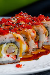 Seared salmon sushi rolls with tobiko roe © Cavan