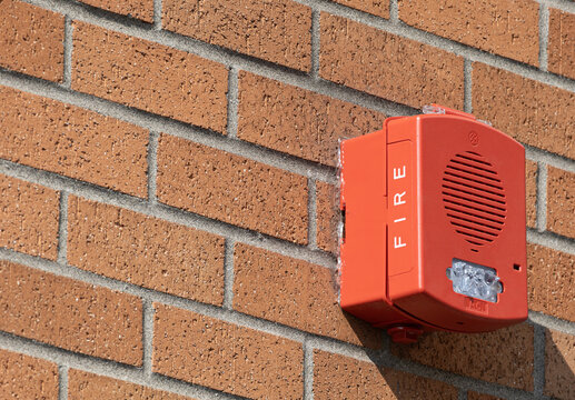 Fire Alarm Notification Device Mounted on Brick Wall