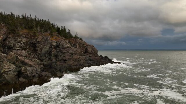Dramatic rocky coastline with waves crashing ashore, Lubec, Maine