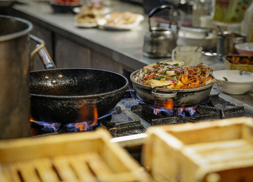 Seafood hot pot simmering on a gas stove