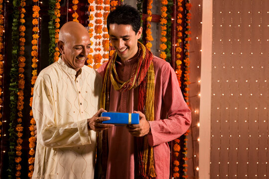 Father giving his son a gift 