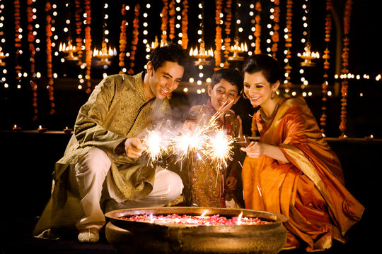 Family playing with fireworks 