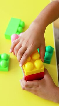 This adorable video features a child's hands assembling a vibrant block system. It's a beautiful example of how constructive play nurtures creativity, fine motor skills, and early problem-solving.