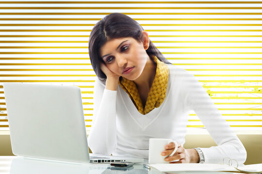 Businesswoman getting bored in an office 