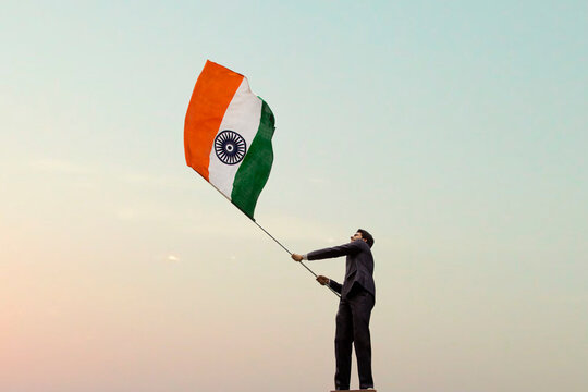 Businessman holding the Indian flag 