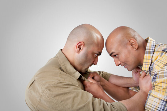 Bald men fighting 