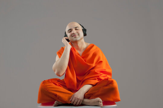 Monk listening to music 