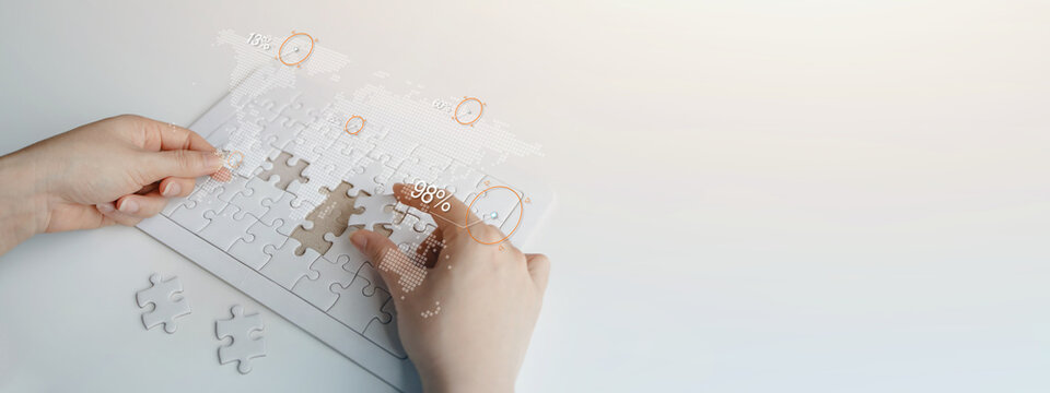 Hands assembling puzzle pieces with digital business icons, representing innovation, digital transformation, strategic planning, business solutions, technology integration, and organizational growth.