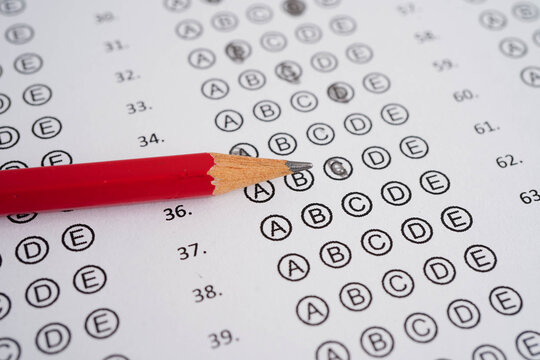 Answer sheets with pencil drawing fill to select choice, education concept.