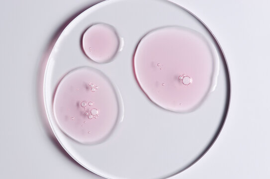 Pink cosmetic product for skin care. A serum or body gel or a moisturizer.