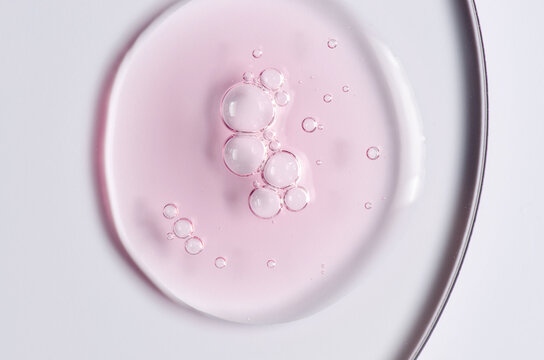 Pink cosmetic product for skin care. A serum or body gel or a moisturizer.