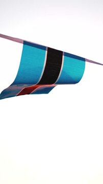 National flag of Botswana waving in the wind, symbolizing Botswana&rsquo;s independence, national identity and patriotic pride. Ideal for Botswana Day, Independence Day celebrations, African history.