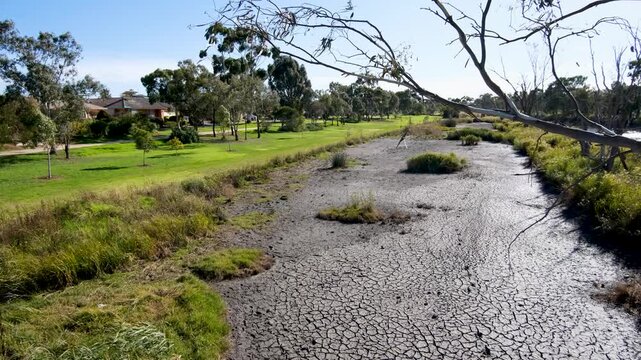 Skeleton Creek forms a key natural boundary along the edge of Seabrook, Melbourne Australia, linear parkland strip and wetlands that separates the residential neighborhood