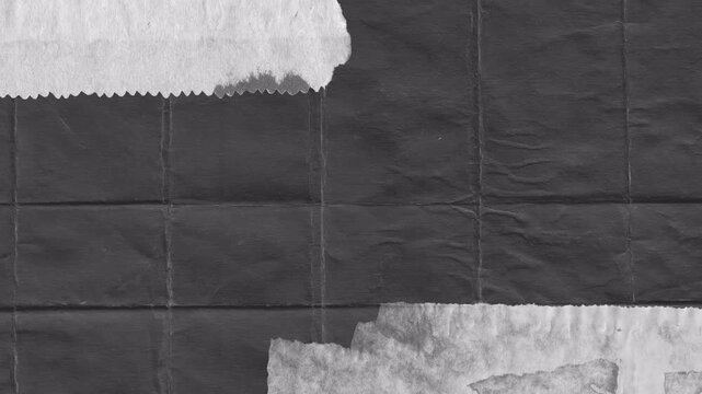 Abstract dark textured background with torn paper edges.