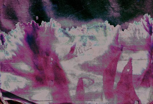 Abstract Purple and Green Ink Spread and Splatter Stain Pattern on Grainy Printer Texture Paper Background