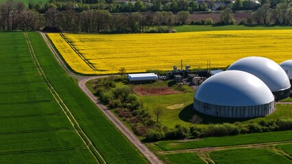 Aerial Biogas Plant Beside Rapeseed Fields in Rural Landscape © Maik