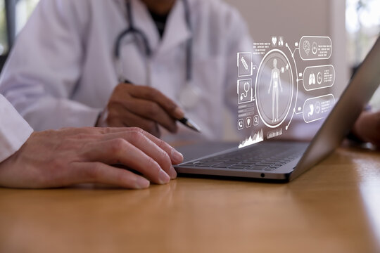Doctor using a tablet with digital healthcare interface showing human body and organ data, representing medical technology, patient monitoring, diagnosis, telemedicine smart hospital innovation.