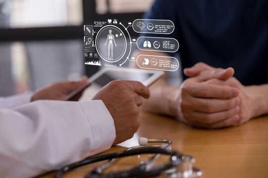 Doctor using a tablet with digital healthcare interface showing human body and organ data, representing medical technology, patient monitoring, diagnosis, telemedicine smart hospital innovation.
