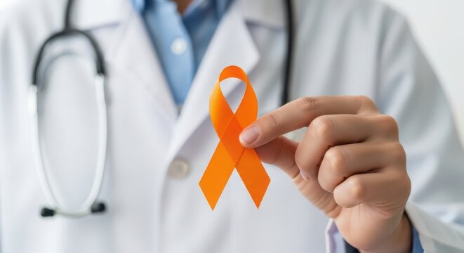 Doctor holding an orange awareness ribbon for leukemia and kidney cancer support