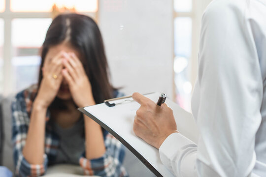 psychologist talking with depressed patient about mental condition.
