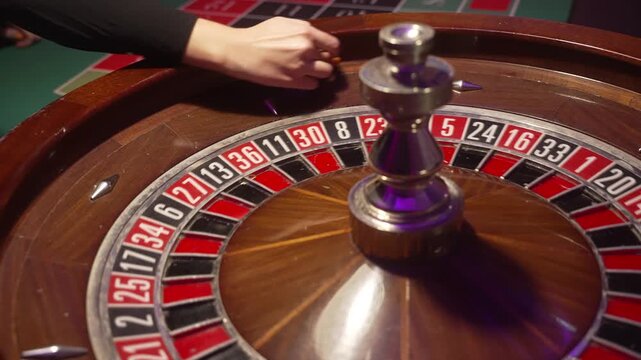 Woman Placing Chip On Roulette Number, Strategic Bet Before Spin