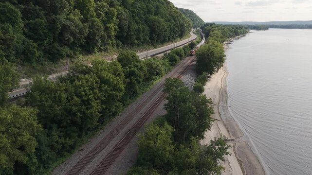 A freight train moves north along the Wisconsin side of Great River Road on the Mississippi River.