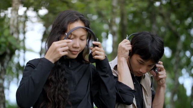 Sound Recordists Capturing Natural Forest Ambience with Professional Microphone