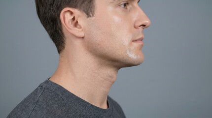 Fototapeta premium Side Profile of Handsome Young Man with Oily Shiny Skin on Jawline and Chin