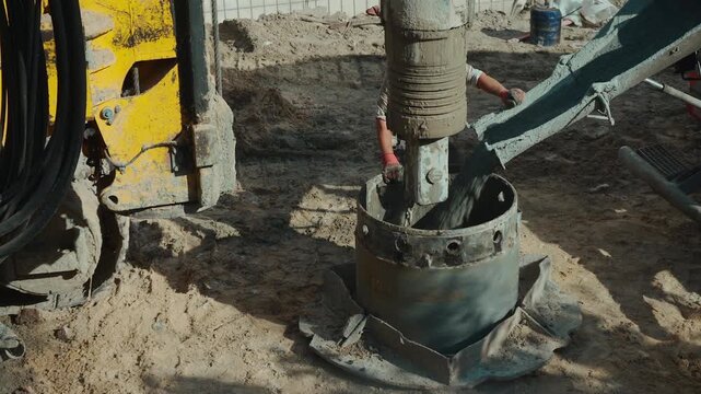 pile driver heavy machinery for concrete work at construction site, industrial piling machine for foundation building 4k