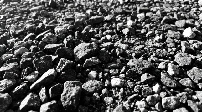 Abstract texture of dark crushed stones and gravel.