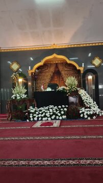 Elegant Mosque Mihrab Decorated with White Flowers for Islamic Wedding Ceremony