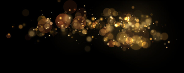 Soft glowing golden bokeh lights scattered horizontally on black background with varying sizes and intensities on transparent background © svetilo