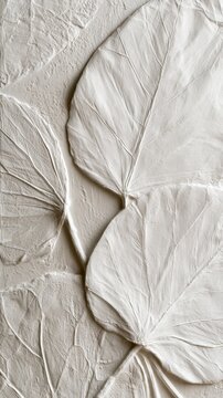 White embossed oversized leaf relief texture background with bold sculpted foliage for wall covering and interior surface design
