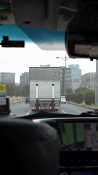 Interior View of Taxi Driving Through Tokyo City Streets