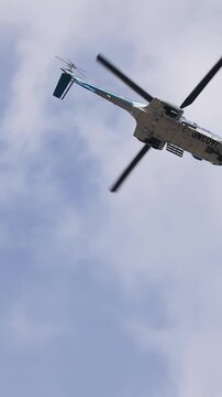 Helicopter Flying Through Cloudy Sky in Tokyo Japan