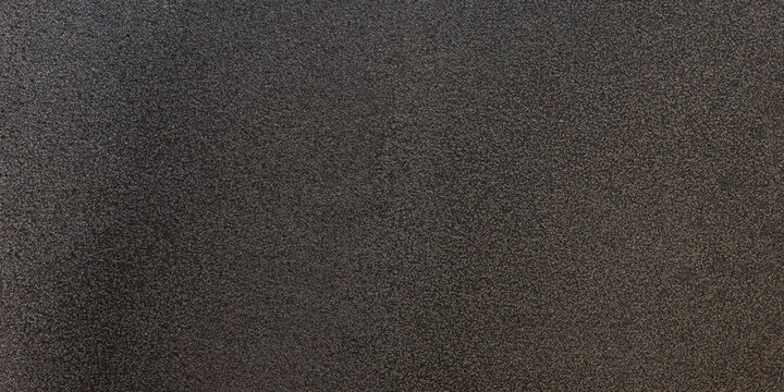 Black basalt granite texture with matte rough surface dark stone background