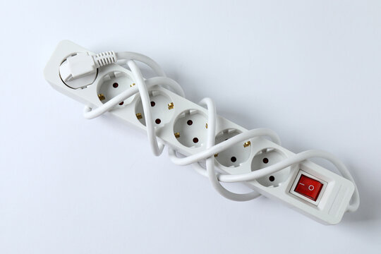Electric extension cord on a colored background
