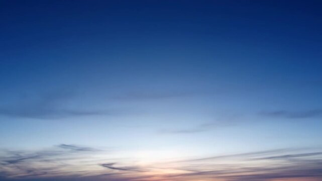 Evening or early morning gradient sky background. Blue hour atmosphere with thin, cirrus clouds and a rich color transition, ideal for copy space and natural backdrops.