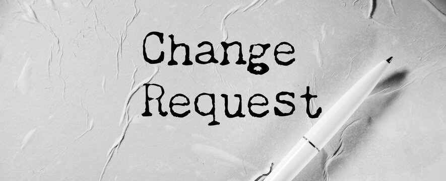 Change request message written on lined card with pen