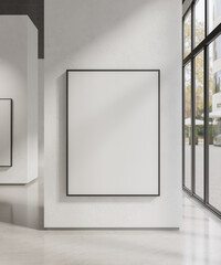Black frame poster mockup hanging on white wall in art gallery or modern building with large window © bongkarn